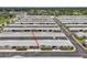Aerial shot of residential buildings with mature landscaping and parking at 12400 Park Blvd # 519, Seminole, FL 33772