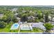 Community aerial view showcasing a pool, shuffleboard and tennis courts at 12400 Park Blvd # 519, Seminole, FL 33772