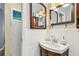 Bathroom view showcasing vanity with decorative fixtures and stylish mirror at 12400 Park Blvd # 519, Seminole, FL 33772