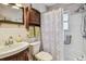 Cozy bathroom featuring a vanity with sink, decorative shower curtain, and tile surround at 12400 Park Blvd # 519, Seminole, FL 33772