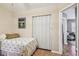 Bedroom showcases a closet, wood floors, and an adjoining space for versatile use at 12400 Park Blvd # 519, Seminole, FL 33772