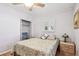 Bedroom features a ceiling fan, shuttered windows, closet, soft color palette, and wood-look floors at 12400 Park Blvd # 519, Seminole, FL 33772