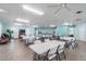 Well-lit common room equipped with a kitchen area, dining sets, and ample seating at 12400 Park Blvd # 519, Seminole, FL 33772