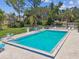 Refreshing community pool with plenty of lounge chairs and a relaxing view at 12400 Park Blvd # 519, Seminole, FL 33772
