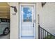 Inviting front door with decorative glass and convenient handrail access into home at 12400 Park Blvd # 519, Seminole, FL 33772