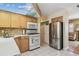 Functional kitchen with stainless steel appliances, granite countertops, and tiled floors at 12400 Park Blvd # 519, Seminole, FL 33772