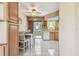 Inviting eat-in kitchen with bright white tile flooring and a sliding door to the backyard at 12400 Park Blvd # 519, Seminole, FL 33772