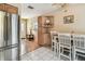 Bright and functional kitchen with modern stainless steel appliances and a dining nook at 12400 Park Blvd # 519, Seminole, FL 33772