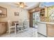 Cozy kitchen with a casual dining table, tiled floors, and sliding doors to the backyard at 12400 Park Blvd # 519, Seminole, FL 33772