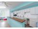 Well-appointed kitchenette with cabinets and counter space for events in the common room at 12400 Park Blvd # 519, Seminole, FL 33772