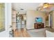 An open-concept living area featuring hardwood floors and views of the kitchen and dining room at 12400 Park Blvd # 519, Seminole, FL 33772