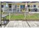 Relaxing patio area with white picket fence, shaded seating, and outdoor decor, perfect for entertaining at 12400 Park Blvd # 519, Seminole, FL 33772