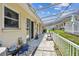 Covered patio area with walkway, featuring decorative landscaping and charming coastal-themed accents at 12400 Park Blvd # 519, Seminole, FL 33772
