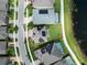 An aerial view of the house showcasing its backyard within a defined property line at 12821 Satin Lily Dr, Riverview, FL 33579