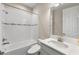 Bathroom showcasing a tub, a single vanity, and clean white tile at 12821 Satin Lily Dr, Riverview, FL 33579
