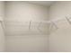 Walk-in closet featuring white metal shelving perfect for clothing and storage at 12821 Satin Lily Dr, Riverview, FL 33579
