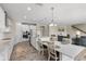 Open kitchen and living area with an island and stainless steel appliances at 12821 Satin Lily Dr, Riverview, FL 33579