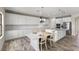 Modern kitchen with white cabinetry, a large island, and stainless steel appliances at 12821 Satin Lily Dr, Riverview, FL 33579