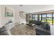 Bright living room with water views, staircase, and contemporary decor at 12821 Satin Lily Dr, Riverview, FL 33579