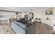 Open-concept living room showcasing a modern kitchen and dining area at 12821 Satin Lily Dr, Riverview, FL 33579