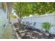 Cozy backyard with outdoor seating, lush greenery, and a privacy fence at 1415 7Th N Ave, St Petersburg, FL 33705