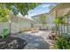 Charming backyard with stylish patio furniture, lush plants, and stone pavers, perfect for outdoor entertaining and relaxation at 1415 7Th N Ave, St Petersburg, FL 33705