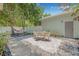 Charming backyard with stylish patio furniture, lush plants, and stone pavers, perfect for outdoor entertaining and relaxation at 1415 7Th N Ave, St Petersburg, FL 33705