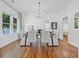 Elegant dining room with modern chandelier and natural light at 1415 7Th N Ave, St Petersburg, FL 33705