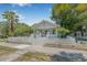Charming single-story home with a well-manicured front yard and white picket fence at 1415 7Th N Ave, St Petersburg, FL 33705