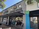 Quaint coffee house featuring a mural on the exterior with cafe tables outside at 1415 7Th N Ave, St Petersburg, FL 33705