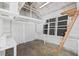 Spacious garage interior with ample storage and shelving, perfect for workshop or parking at 1415 7Th N Ave, St Petersburg, FL 33705