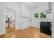 Bright kitchen with white cabinets, stainless steel appliances, and hardwood floors at 1415 7Th N Ave, St Petersburg, FL 33705