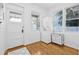 Functional laundry room with stacked washer and dryer, natural light, and ample space, adding convenience to daily chores at 1415 7Th N Ave, St Petersburg, FL 33705