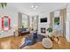 Cozy living room showcasing a fireplace, hardwood floors, and plenty of natural light, offering a comfortable living space at 1415 7Th N Ave, St Petersburg, FL 33705