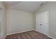 Cozy bedroom featuring neutral walls, carpeted floors, and a double door closet for ample storage space at 14817 Summer Branch Dr, Lithia, FL 33547