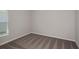 Cozy bedroom features neutral walls, plush carpeting and a window with blinds, offering a comfortable retreat at 14817 Summer Branch Dr, Lithia, FL 33547