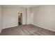 Spacious bedroom features plush carpeting, neutral walls and a door to the bathroom, offering a comfortable retreat at 14817 Summer Branch Dr, Lithia, FL 33547