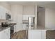 Bright kitchen with stainless steel appliances, white cabinetry, and an island for extra space at 14817 Summer Branch Dr, Lithia, FL 33547