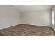 Spacious living room features modern flooring and neutral walls, offering a versatile and inviting living space at 14817 Summer Branch Dr, Lithia, FL 33547