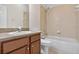 Bathroom with a vanity sink, mirror and combination tub and shower with tile surround at 16102 Colchester Palms Dr, Tampa, FL 33647
