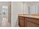 Bathroom featuring vanity with sink, tile floors, and a view of the bedroom at 16102 Colchester Palms Dr, Tampa, FL 33647