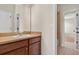 Bathroom vanity, mirror and tile flooring, plus access to bedroom and shower/tub combo at 16102 Colchester Palms Dr, Tampa, FL 33647
