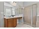 Bathroom featuring a vanity with mirror, a glass enclosed shower, and neutral color scheme at 16102 Colchester Palms Dr, Tampa, FL 33647