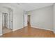 Large empty bedroom with laminate floors and light gray walls with white trim at 16102 Colchester Palms Dr, Tampa, FL 33647