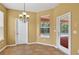 Cozy breakfast nook featuring tile flooring, a chandelier, and a view of the pool area at 16102 Colchester Palms Dr, Tampa, FL 33647