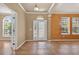 Welcoming foyer with tile flooring, decorative medallion, and natural light streaming through the front door and sidelights at 16102 Colchester Palms Dr, Tampa, FL 33647