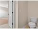 This half bathroom features neutral paint, tile floors, and a toilet at 16102 Colchester Palms Dr, Tampa, FL 33647