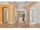 Open hallway with tile flooring, archways, and views to other rooms at 16102 Colchester Palms Dr, Tampa, FL 33647