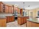 Spacious kitchen features granite countertops, stainless steel appliances, and custom wood cabinets with wine storage at 16102 Colchester Palms Dr, Tampa, FL 33647