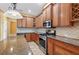 Well-appointed kitchen with stainless steel appliances, granite countertops, and custom cabinets with ample storage at 16102 Colchester Palms Dr, Tampa, FL 33647